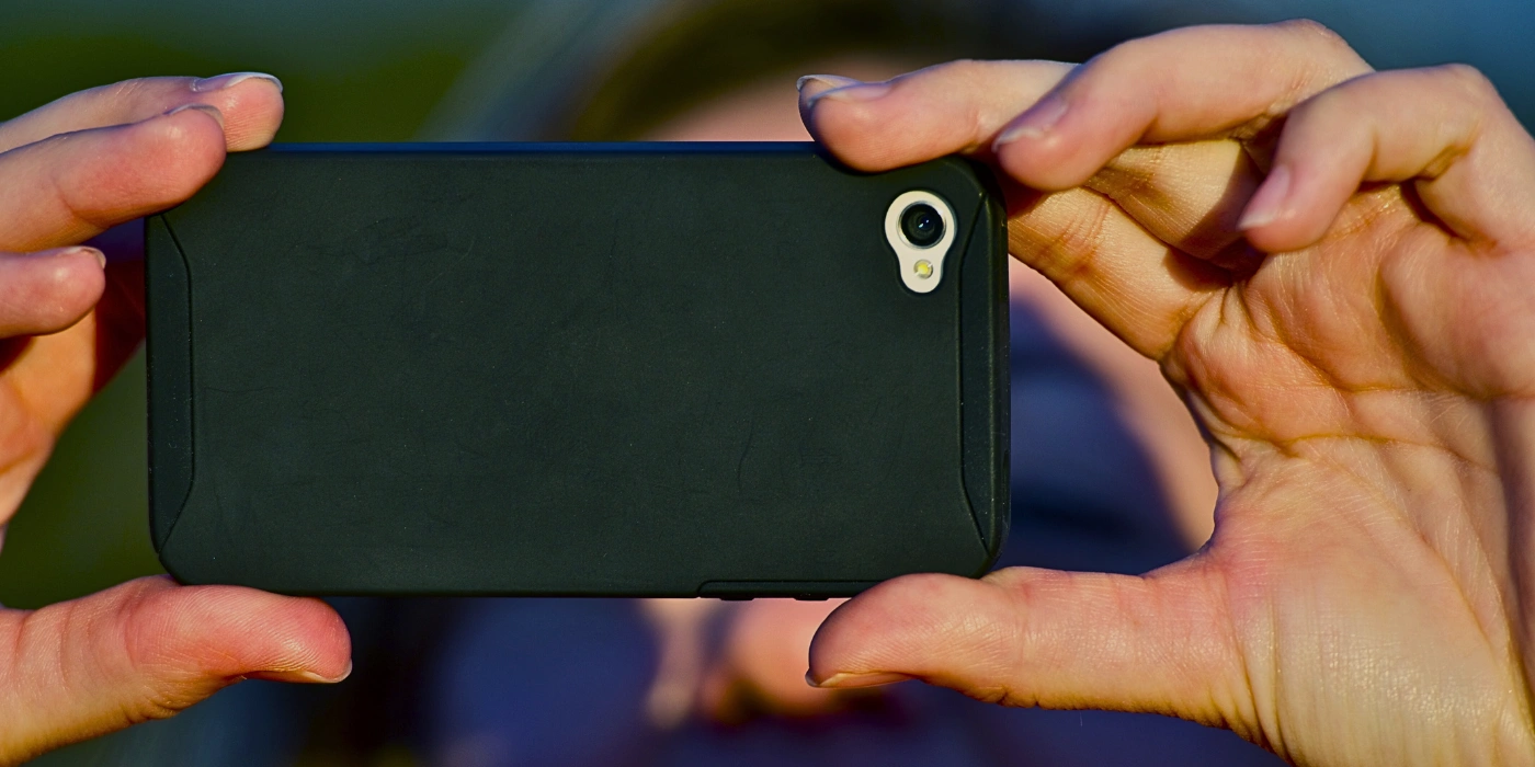 A woman taking pictures in kundasang by following our Kundasang photography guide.