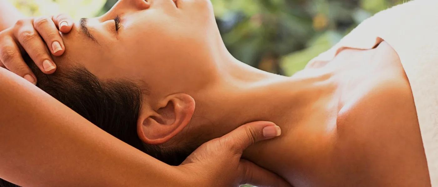 A woman enjoying a relaxing massage in Kundasang.