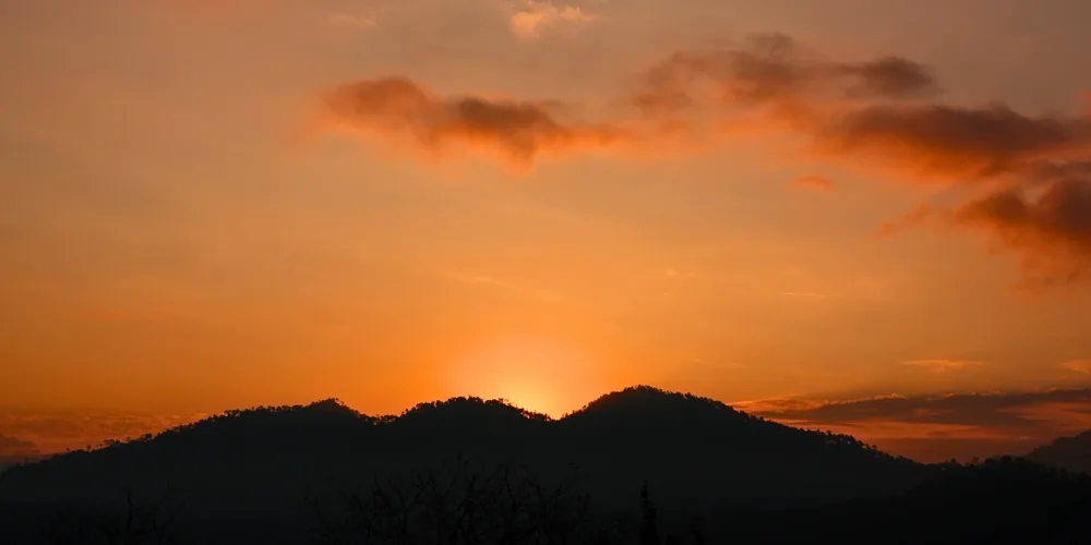 The sun emerging behind the mountains- sunrise spots in Kundasang