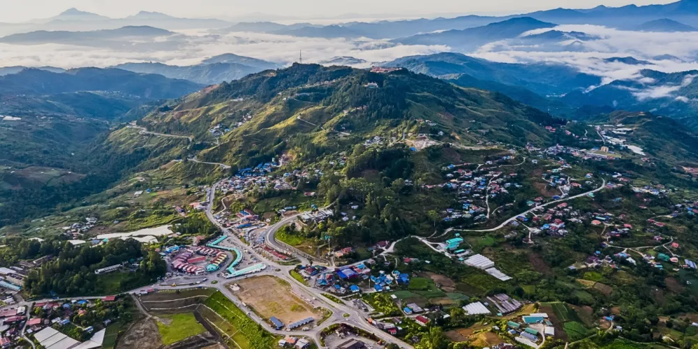 Panaromic view of Kundasang. Featuring winding roads, highland homes and farms, centering the stage for cultures in Kundasang