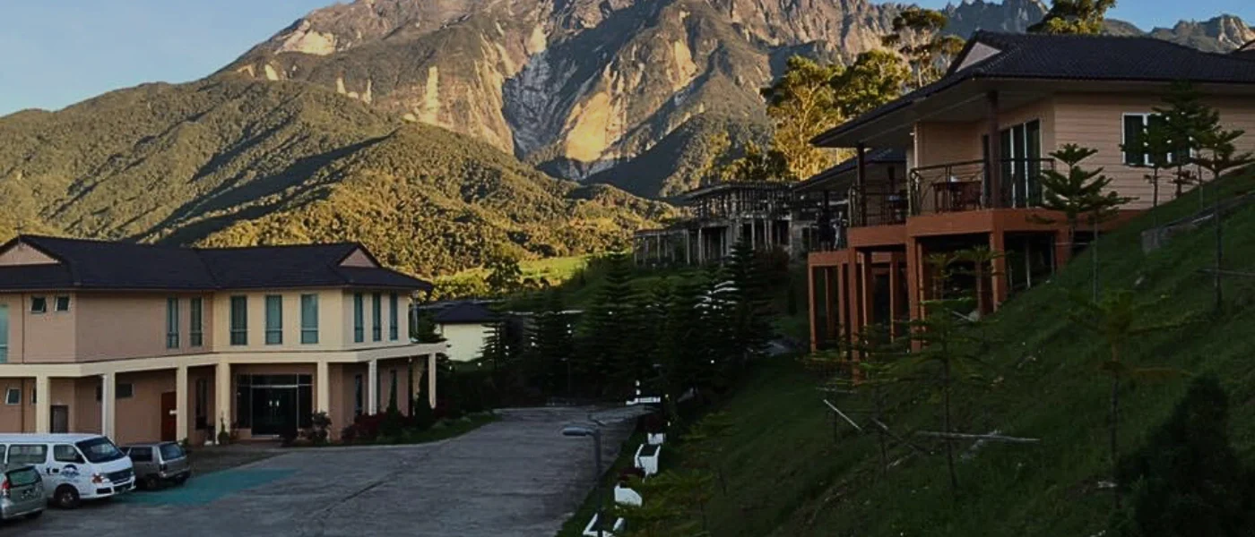 Dream World Resort – A Romantic Escape for Couples Dream World Resort in Kundasang showing a romantic villa surrounded by lush foliage and soft lighting, ideal for couples