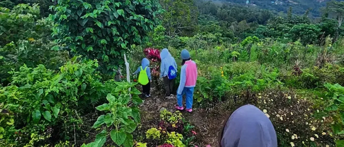 Children walking down Kimondou Hill after completing their hike to the peak.