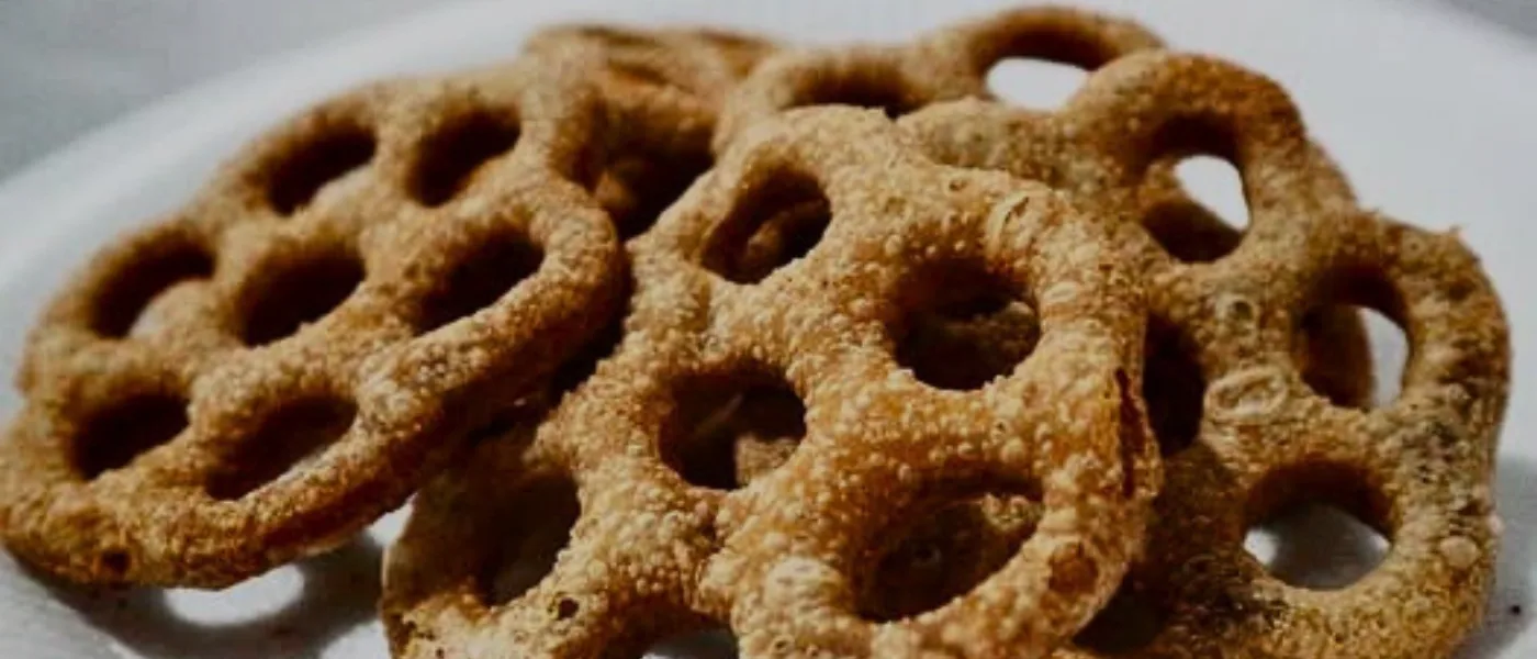 Close-up of kuih cincin, a traditional Malaysian ring-shaped snack made from rice flour and palm sugar