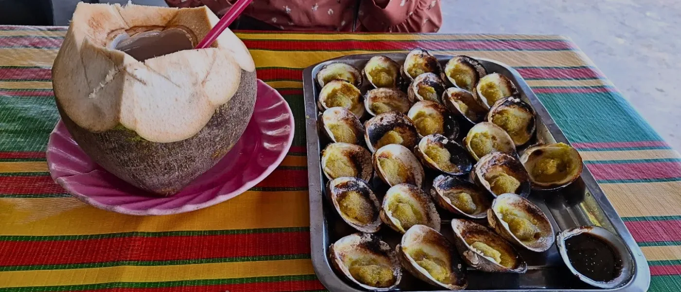 Lokan bakar is a beloved seafood dish in Kundasang, featuring fresh clams grilled to perfection and seasoned with local spices—savory, smoky, and deeply satisfying. (Photo by: Raihan Ahmad)