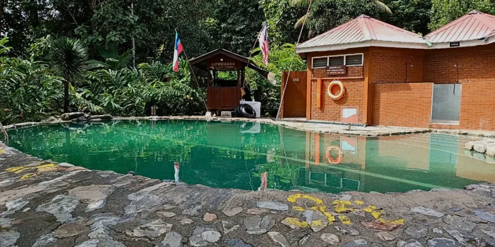 A spacious natural hot spring pool at Poring