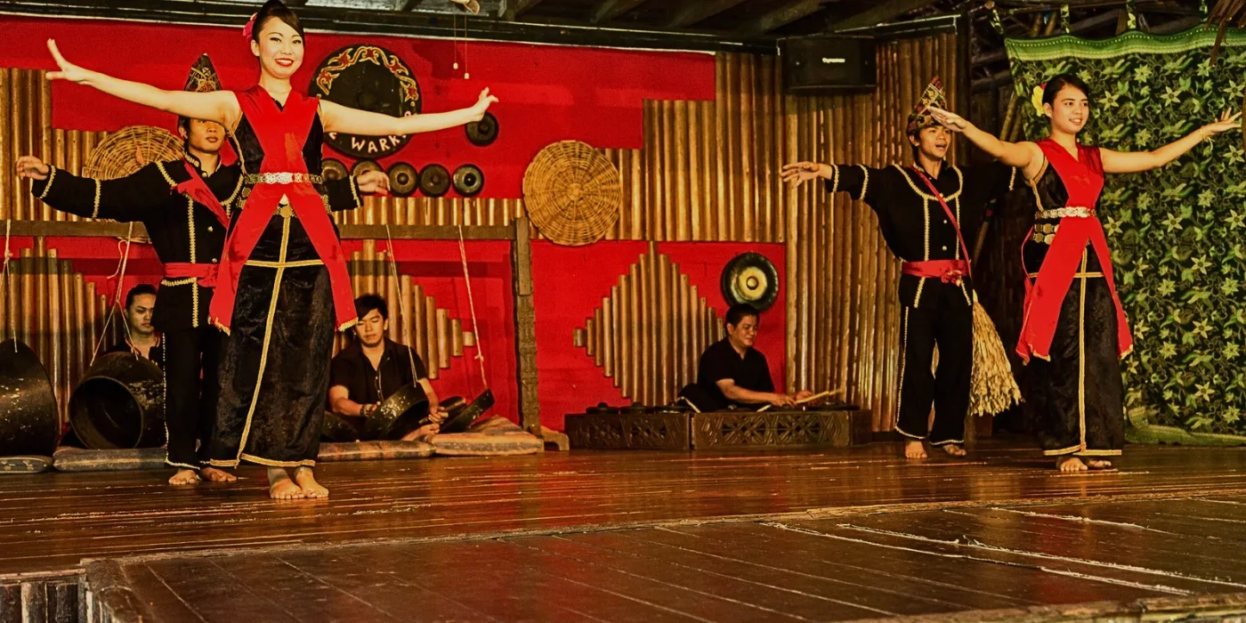 Dusun dancers in traditional attire performing the Sumazau dance